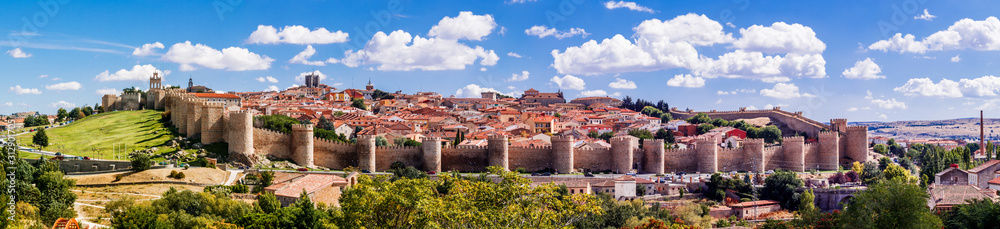 Beautiful picturesque panoramic view of the historic city of Avila from the Mirador of Cuatro Postes, Spain, with its famous medieval town walls. UNESCO World Heritage.