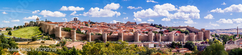 Beautiful picturesque panoramic view of the historic city of Avila from the Mirador of Cuatro Postes, Spain, with its famous medieval town walls. UNESCO World Heritage.