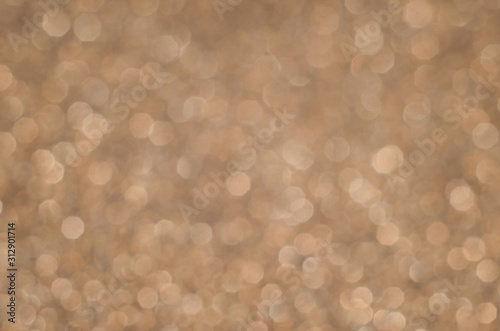 Abstract Christmast brown heart bokeh background with shining defocus sparkles. Blurred glitters shimmering dust macro close up, copy space for text logo