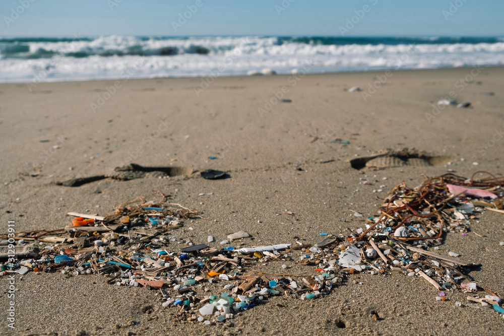 Micro plastics sea coast pollution, polluted ecosystem planet save concept Micro plastics sea coast pollution, polluted ecosystem planet save concept