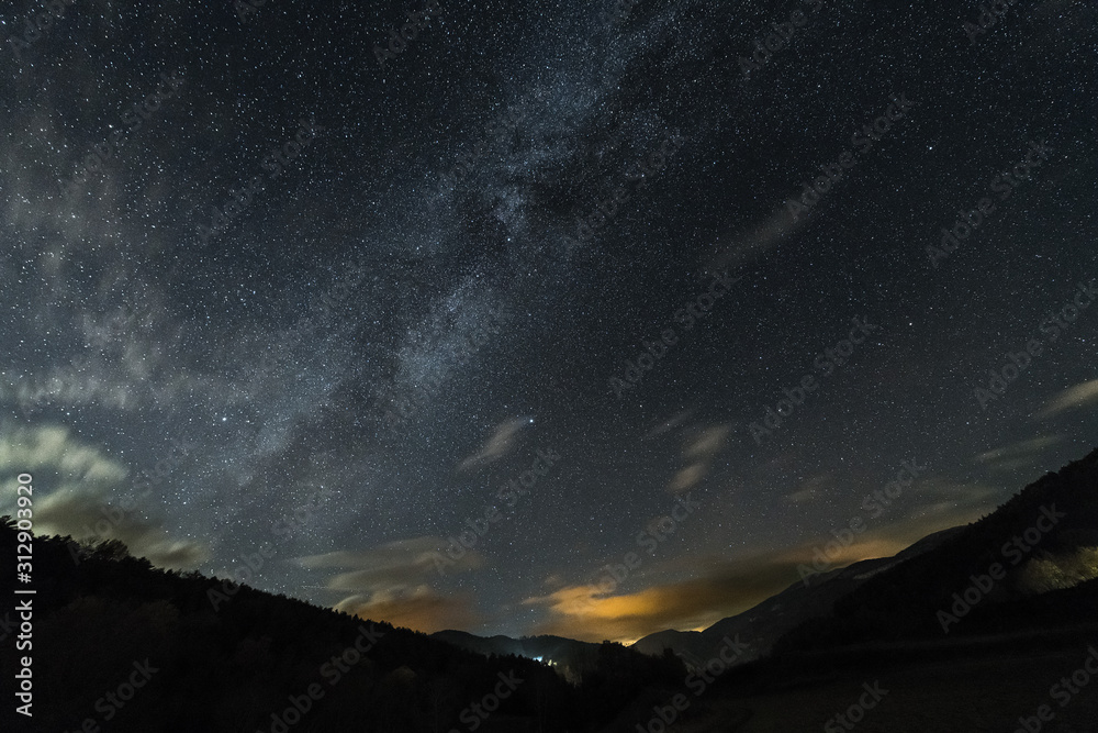 starry sky over the valley of a mountain landscape