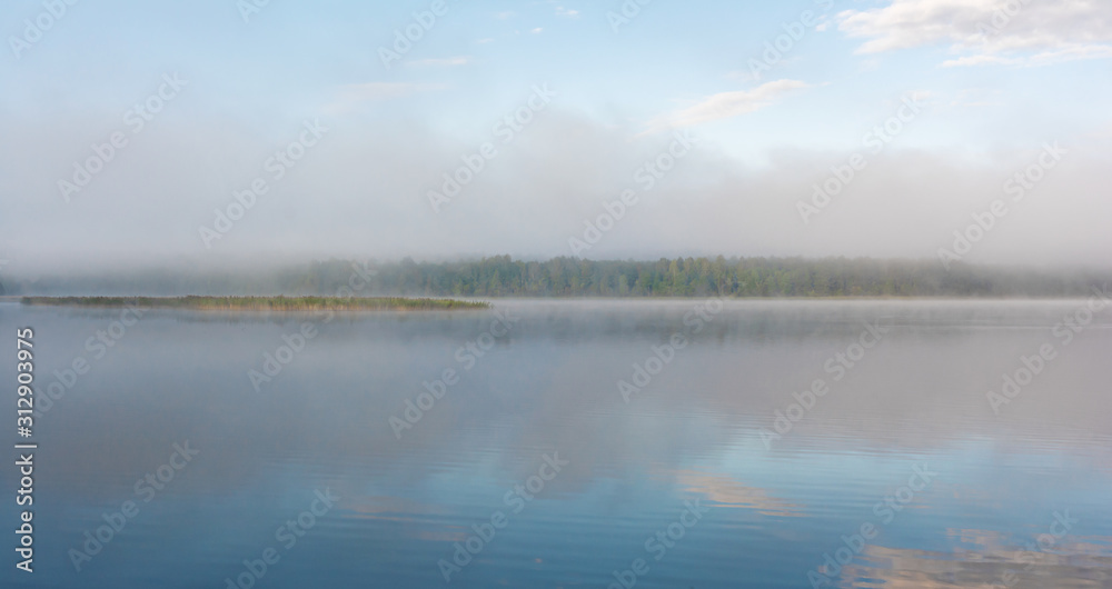 Fog on the lake. Pskov region, Russia