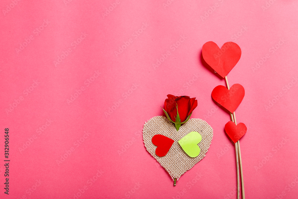 Little heart,red rose flower and gift box on pink background.Valentine day concept 