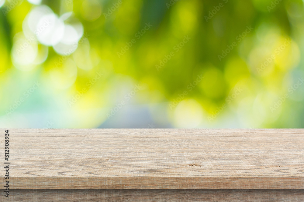 Wood floor with blurred trees of nature park background and summer season, product display montage Wood floor with blurred trees of nature park background and summer season, product display montage