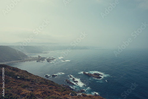Foggy ocean coast line vintage toned © nevodka.com