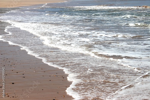 waves coming into shore at beach
