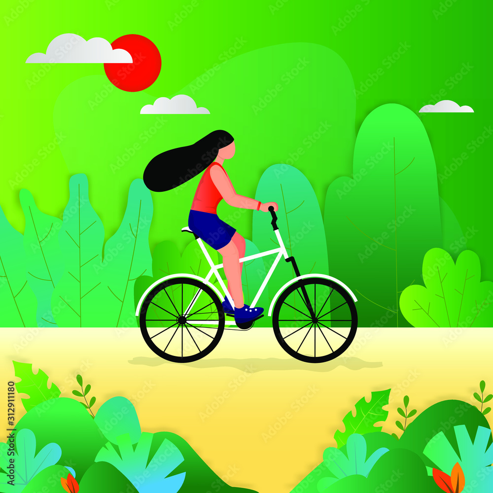 Young woman ride a bicycle in a green garden.