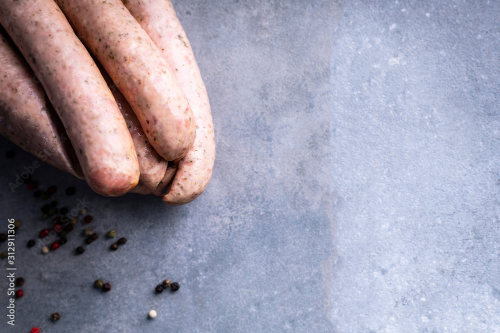 Fototapeta premium Traditional country homemade sausage on a stony background.