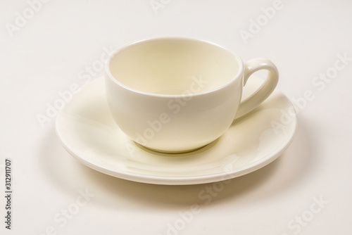 White cup isolated on white background.