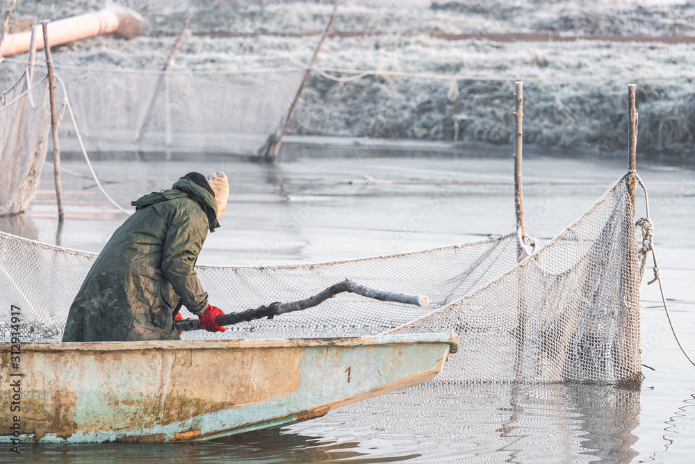 two fishermen and nets at a deep temperature minus two fishermen and nets at a deep temperature minus