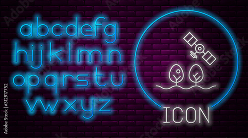 Glowing neon line Smart farm with drone control and tree icon isolated on brick wall background. Innovation technology for agricultural company. Neon light alphabet. Vector Illustration