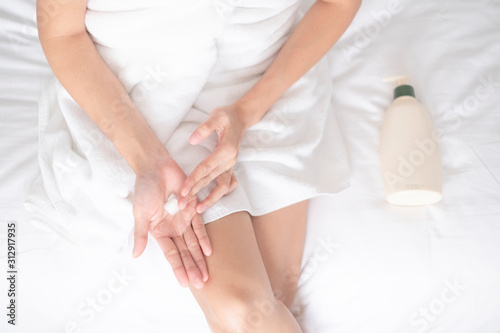 Wallpaper Mural Woman applying moisturizing cream/lotion on hands, beauty concept.. Torontodigital.ca