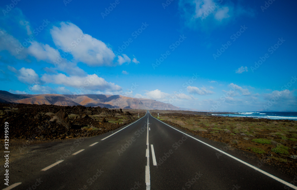 Black road in volcanic land