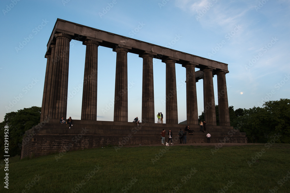 Fototapeta premium National Monument of Scotland in silhouette on Calton Hill, Edinburgh, Scotland