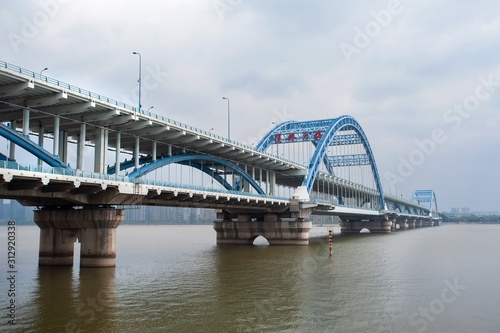 Fuxing Bridge on the Qiantang River, Hanghzou, China. The sign on the bridge reads 'Fuxing Big Bridge' in traditional Chinese.
