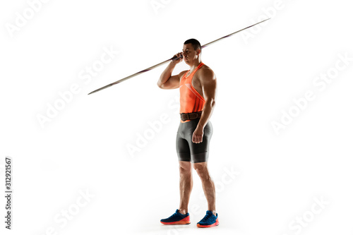 Male athlete practicing in throwing javelin isolated on white background. Professional sportsman, thrower posing confident. Concept of healthy lifestyle, movement, activity, competition. Copyspace.
