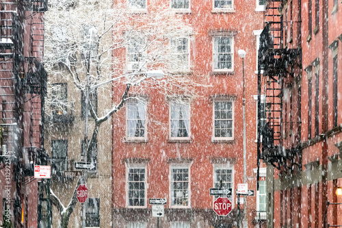 Photography Blowing snow covers the buildings on Waverly Place in the Greenwich Village neig