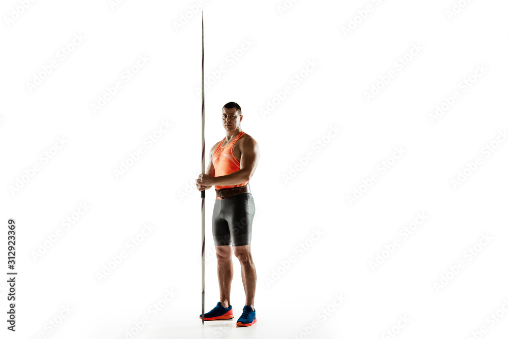 Male athlete practicing in throwing javelin isolated on white background. Professional sportsman, thrower posing confident. Concept of healthy lifestyle, movement, activity, competition. Copyspace.