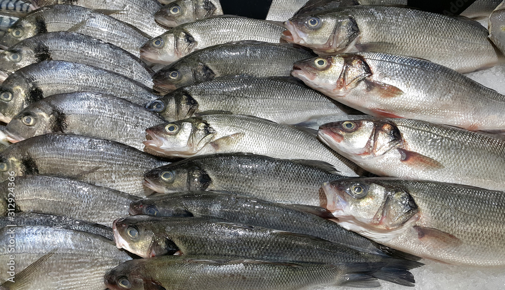 Fresh fish on ice for sale in market Fresh fish on ice for sale in market