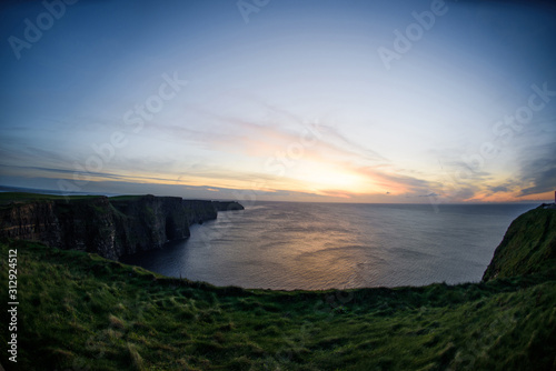 cliffs of moher and sunset sky
