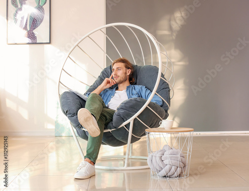 Handsome man with newspaper...