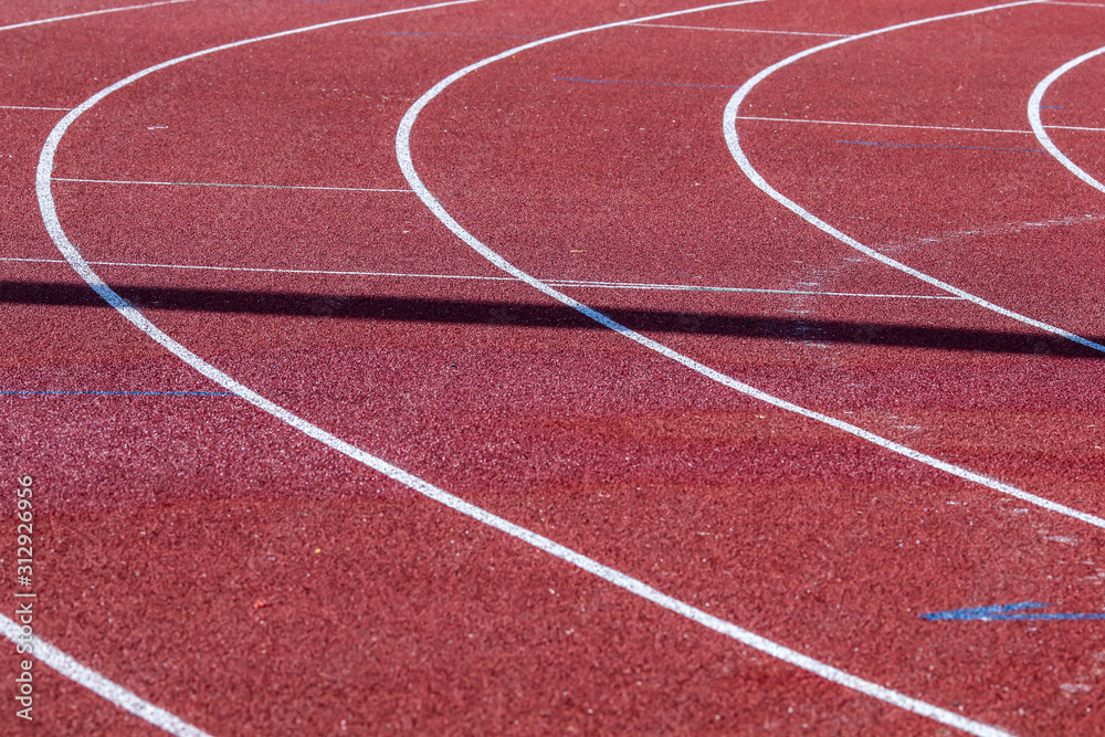 Fototapeta premium Red running sport track background and texture. Sport running track concept.