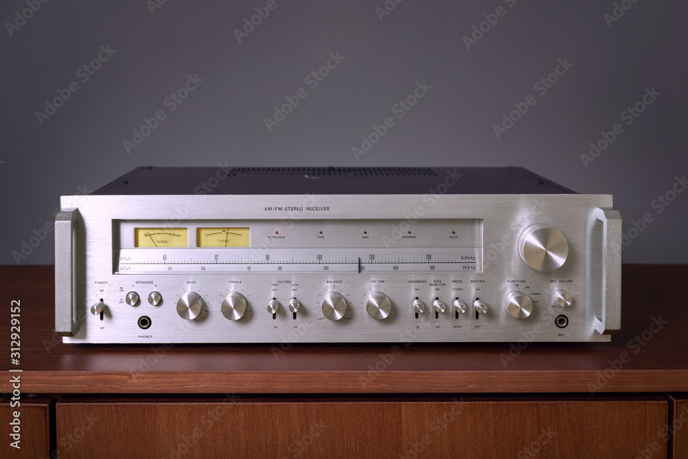 Fototapeta premium Vintage Stereo Receiver Standing on the Wooden Sideboard, Frontal View