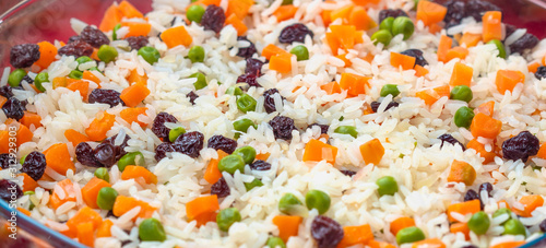 Greek-Style Rice. Brazilian dish. In this image contains rice, raisins, carrots and peas.