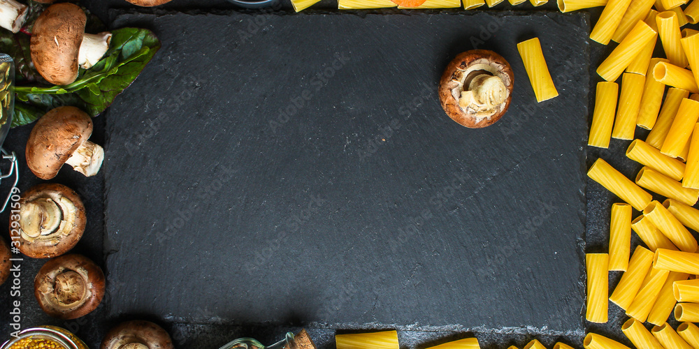 Obraz premium pasta Tortiglioni and ingredients for mushroom sauce (Italian main course Maccheroni, Rigatoni) menu concept. food background. top view. copy space