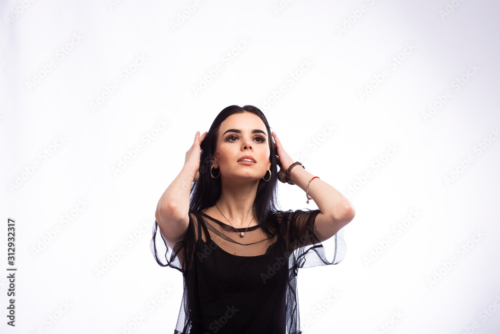 Young beautiful brunette girl on white background Young beautiful brunette girl on white background