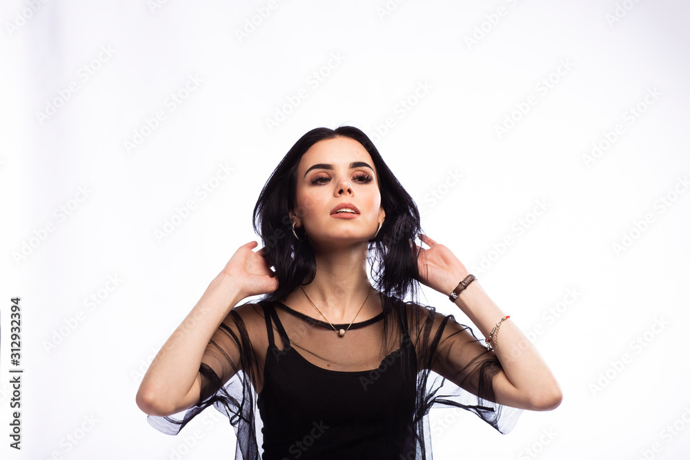 Young beautiful brunette girl on white background