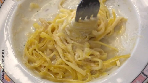 Eating Fettuccine pasta spaghetti