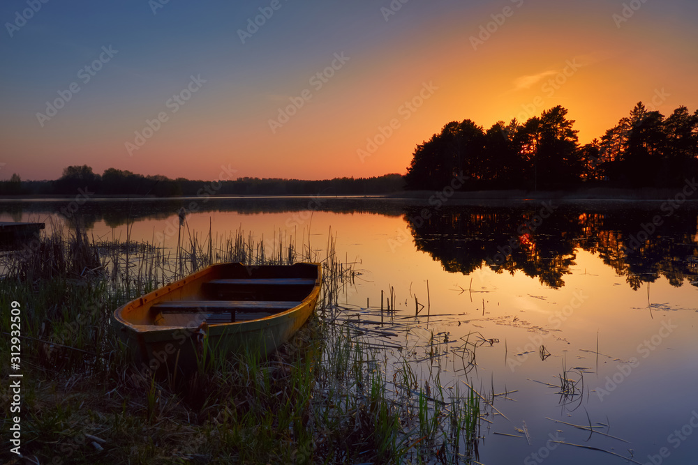 Boat by the lake, beautiful summer evening Boat by the lake, beautiful summer evening