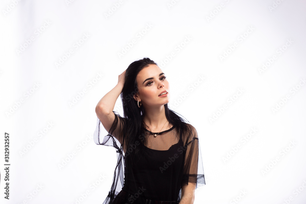 Young beautiful brunette girl on white background Young beautiful brunette girl on white background
