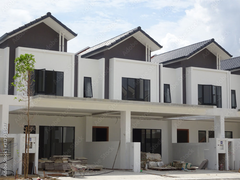 Double story luxury terrace house under construction in Malaysia. Designed by an architect with a modern and contemporary style. Double story luxury terrace house under construction in Malaysia. Designed by an architect with a modern and contemporary style.