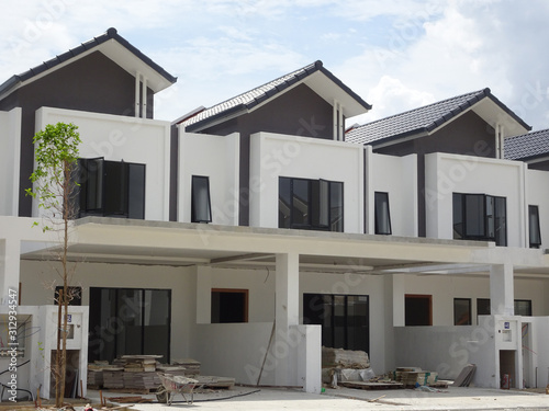 Double story luxury terrace house under construction in Malaysia. Designed by an architect with a modern and contemporary style. 