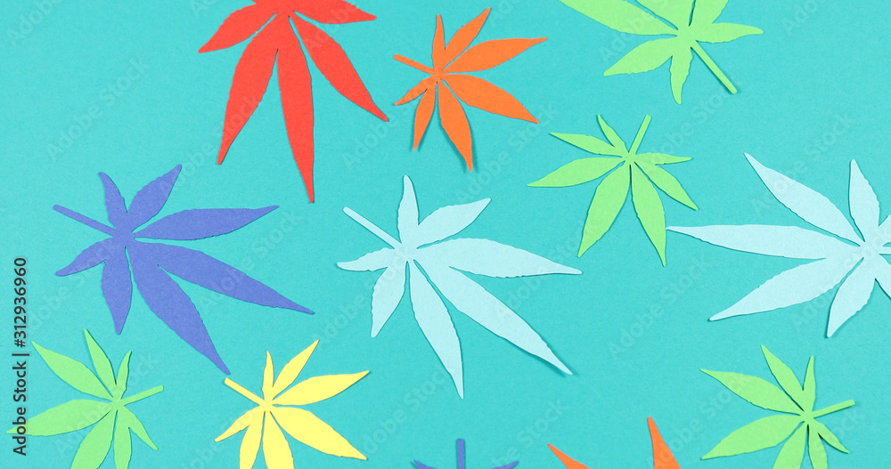 Paper applique paper hemp leaves on colored backgrounds. The concept of legalization. Paper applique paper hemp leaves on colored backgrounds. The concept of legalization.