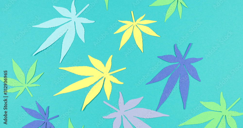 Paper applique paper hemp leaves on colored backgrounds. The concept of legalization. Paper applique paper hemp leaves on colored backgrounds. The concept of legalization.
