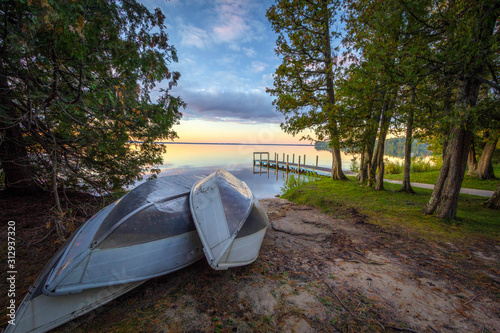 Summer Day At The Lake. Rowboats on lake at Indian Lake State Park in Manistique, Michigan.