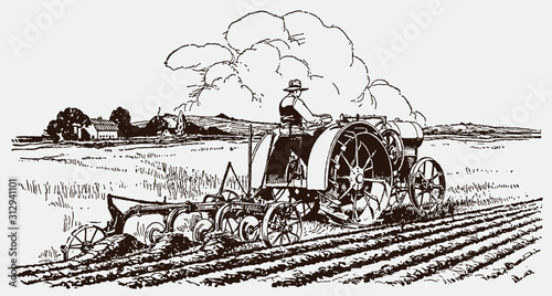 Historical male farmer pulling plow with tractor in field, in three-quarter back view, after engraving from early 20c.