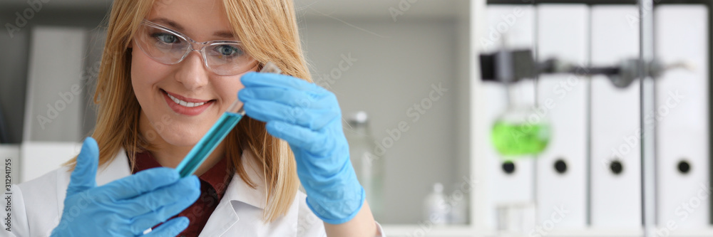 Technician hold in arms in protective gloves Technician hold in arms in protective gloves