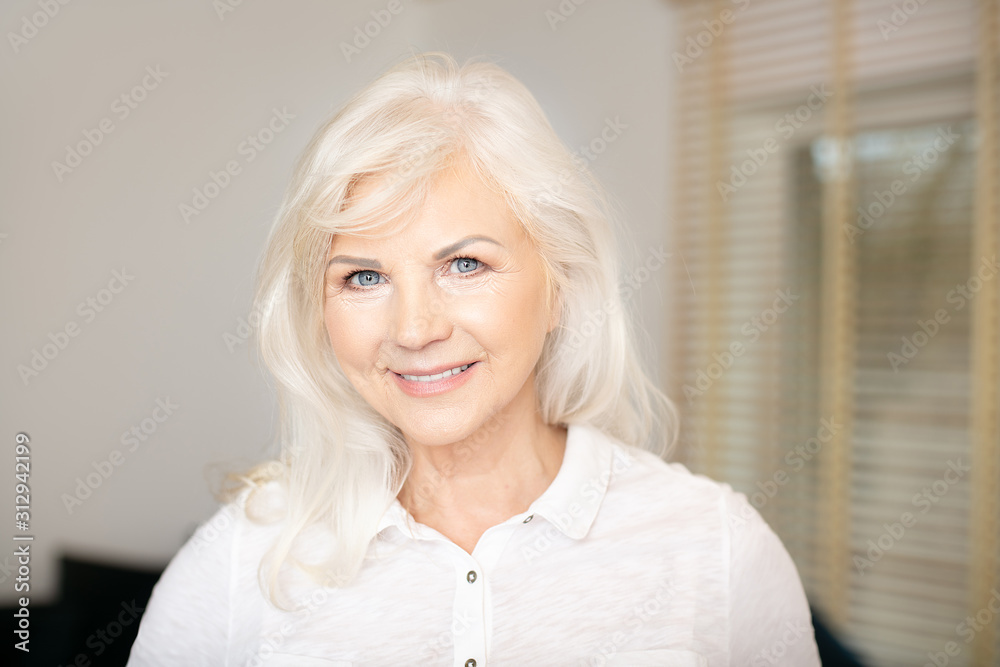 Portrait of elegant senior woman .