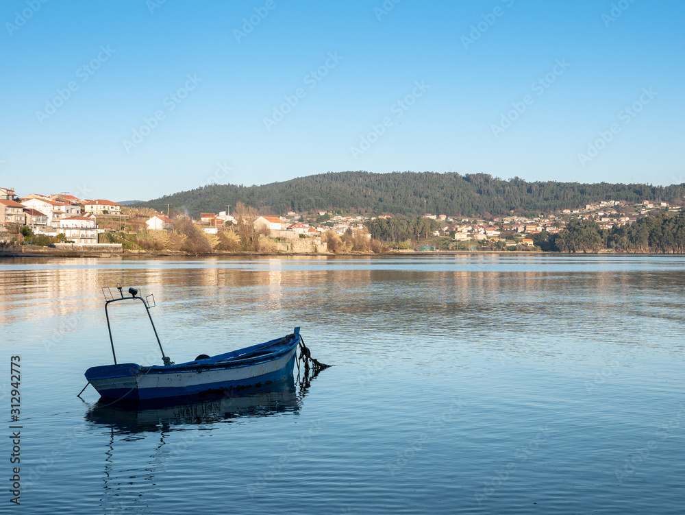 boat on calm waters in Combarro