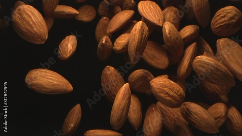 Almond Nuts Flying in the Air in a Free Fall in Slow Motion on Black Background at 1500 fps  4K