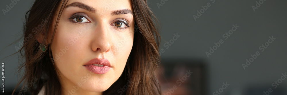 Beautiful smiling girl at workplace look in camera