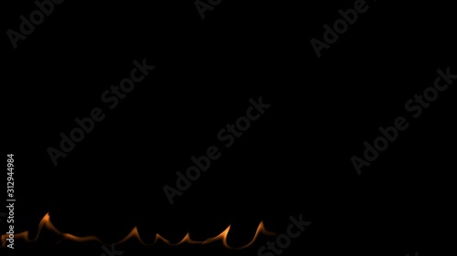 Slow motion fire flames burning gently on an isolated black background