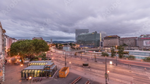 The Schwedenplatz is a square in central Vienna, located at the Danube Canal aerial night to day timelapse photo