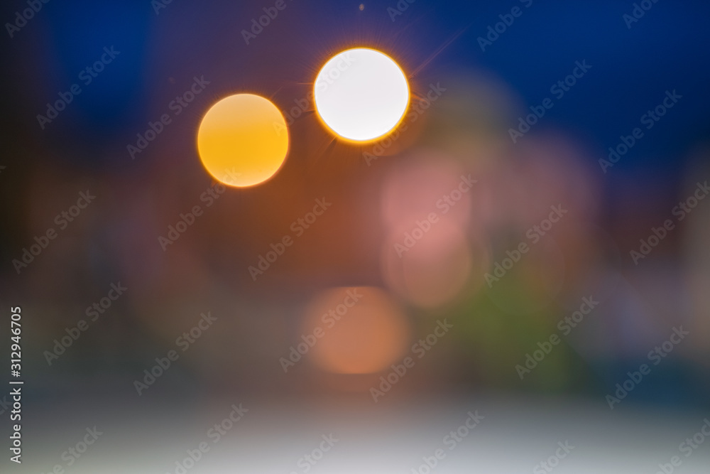 Bright colorful bokeh circles at night. Blurred city lights background. Bright colorful bokeh circles at night. Blurred city lights background.