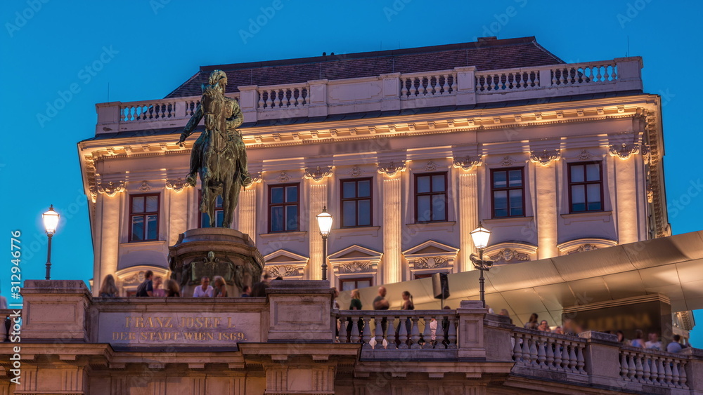 Night view of equestrian statue of Archduke Albert in front of the Albertina Museum day to night timelapse in Vienna, Austria