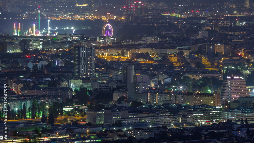 Fototapeta premium Skyline of Vienna from Danube Viewpoint Leopoldsberg aerial night timelapse.